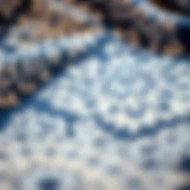 Close-up of intricate designs on a blue throw blanket