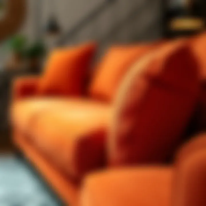 Texture and Material of Orange Sleeper Sofa Close-up of orange fabric sofa showcasing texture and materials