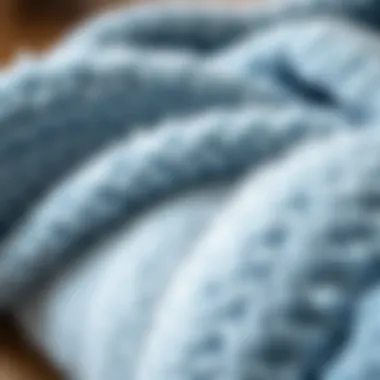 Close-up of the material composition of a light blue UGG blanket